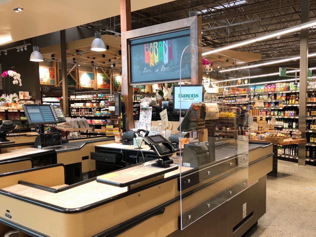 Barons Market in North Park installed plexiglass barriers at each checkout counter to help prevent the potential spread of coronavirus.