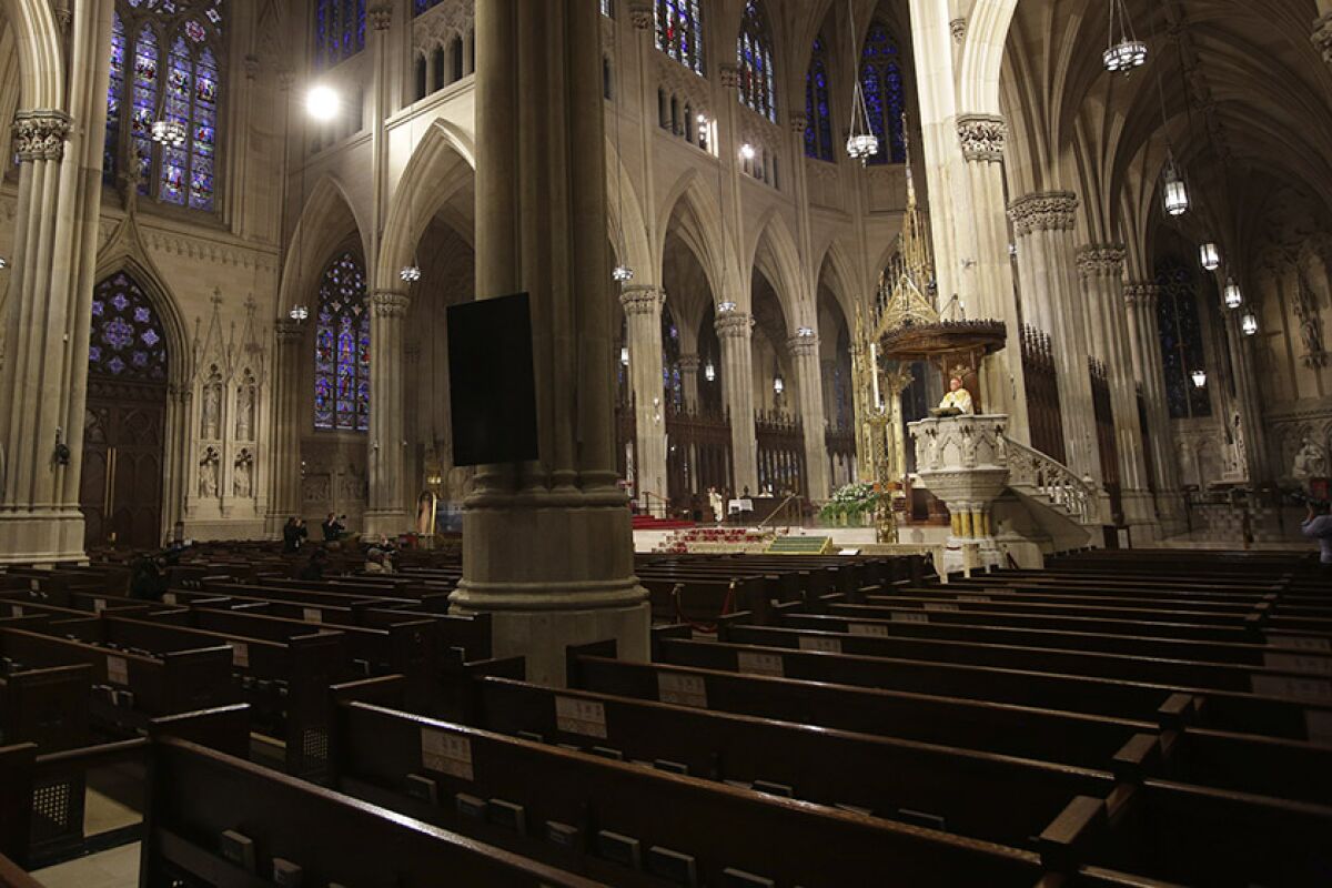 Cardinal Timothy Dolan leads Easter Mass at an empty St. Patrick's Cathedral in New York.
