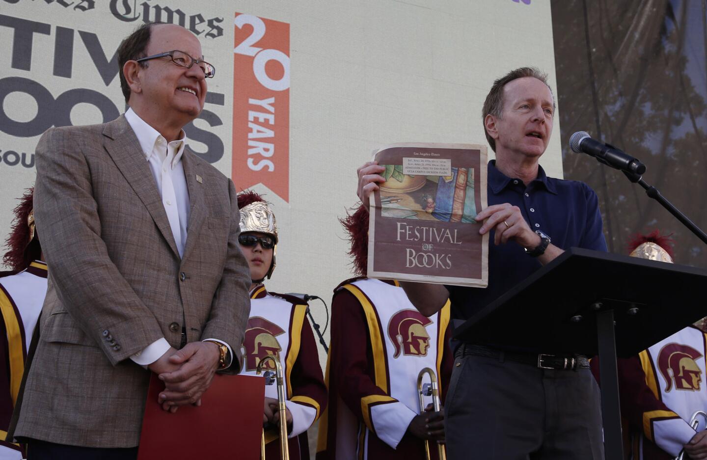 Los Angeles Times Publisher Austin Beutner, right, is joined by USC President C.L. Max Nikias for the official kickoff of the Los Angeles Times Festival of Books on Saturday morning.