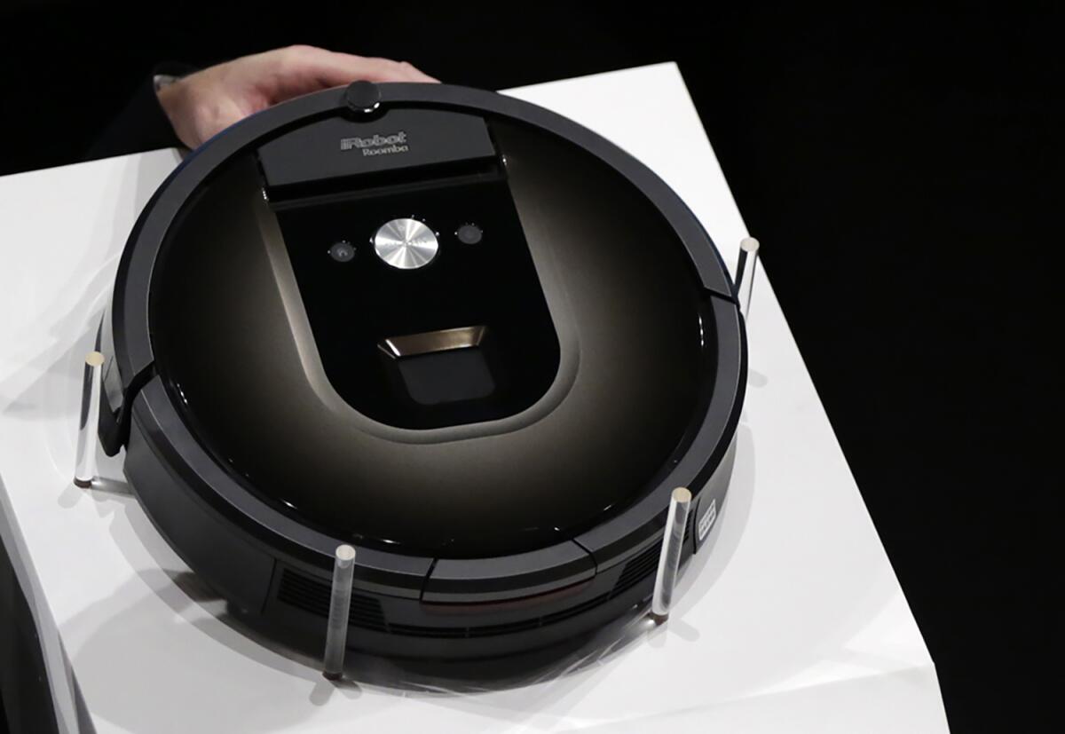 A Roomba 980 vacuum cleaning robot