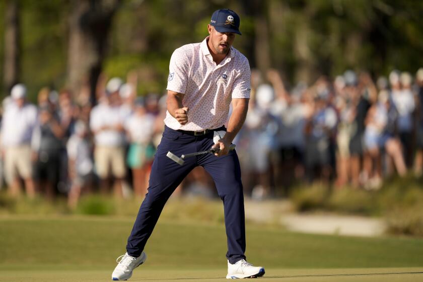 Bryson DeChambeau celebrates after putting for birdie on the 11th hole during the third round of the U.S. Open.