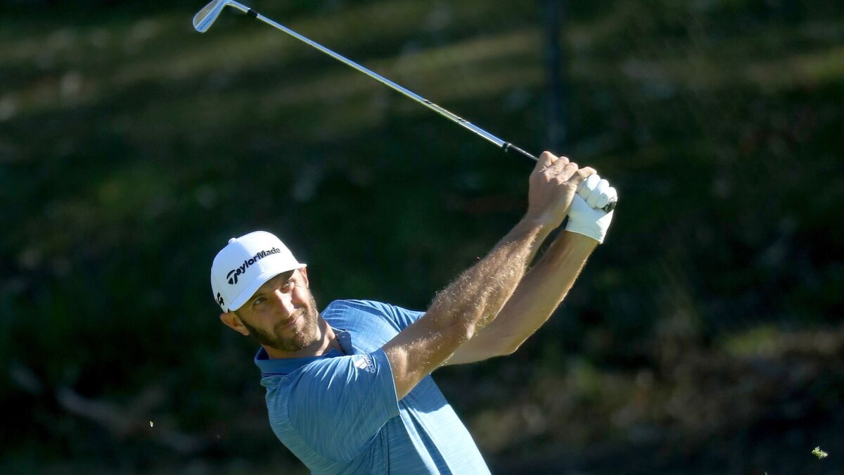 Dustin Johnson plays his approach shot on the 12th hole during the third round of the Genesis Open on Saturday.