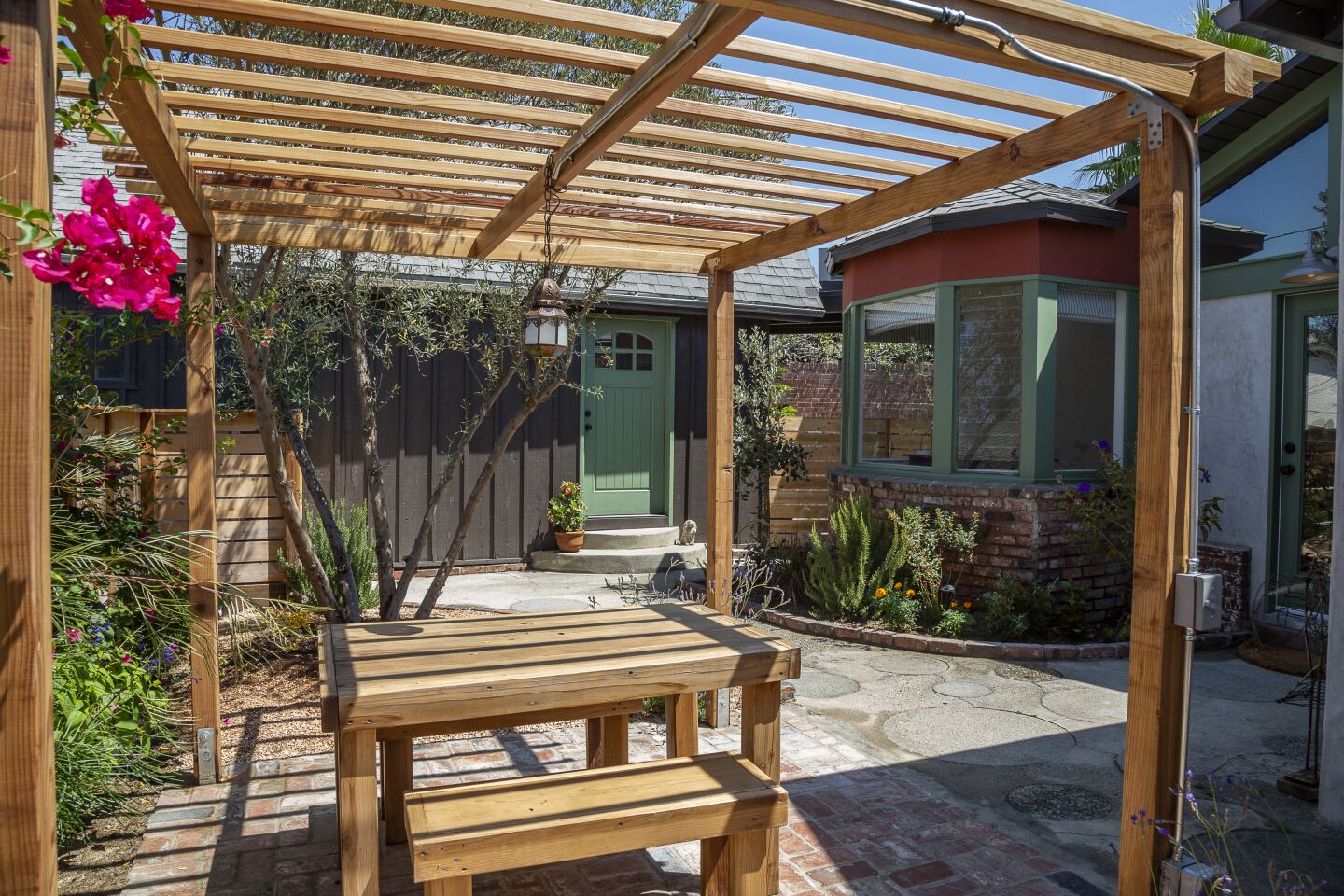A trellis tops the dining patio.