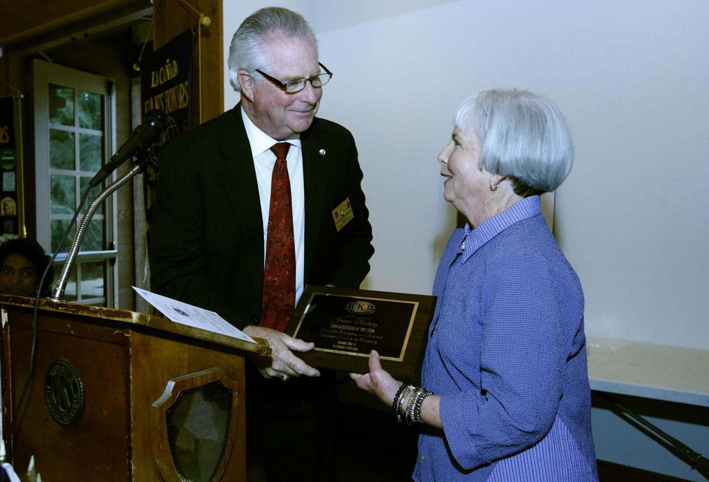 Kiwanis Club of La Cañada president Dr. Michael Leininger gives Jeanne Broberg the plaque for being named 2016 La Cañadan of the Year, during award luncheon at Descanso Gardens in La Cañada Flintridge on Wednesday, April 26, 2017.