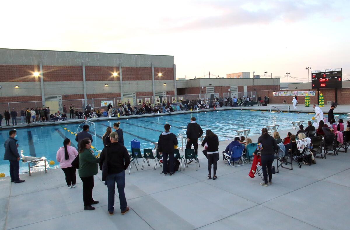 Fans watch the Edison High girls' water polo team play against Fountain Valley in the Chargers' new pool on Tuesday.