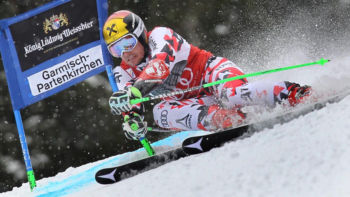 Marcel Hirscher clears a gate during his first giant slalom run in Garmisch-Partenkirchen, Germany, on Sunday.