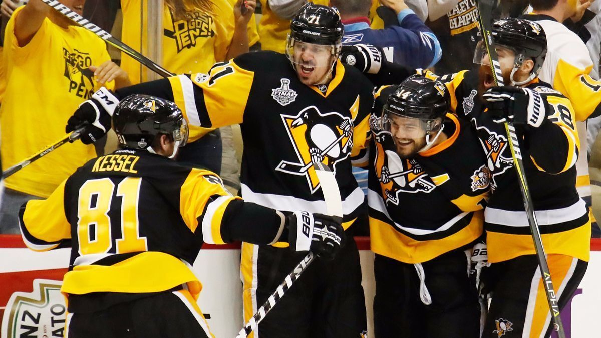 Pittsburgh Penguins' Evgeni Malkin (71) celebrates with teammates after scoring a goal during the third period in Game 2 of the Stanley Cup Final against the Nashville Predators, Wednesday.