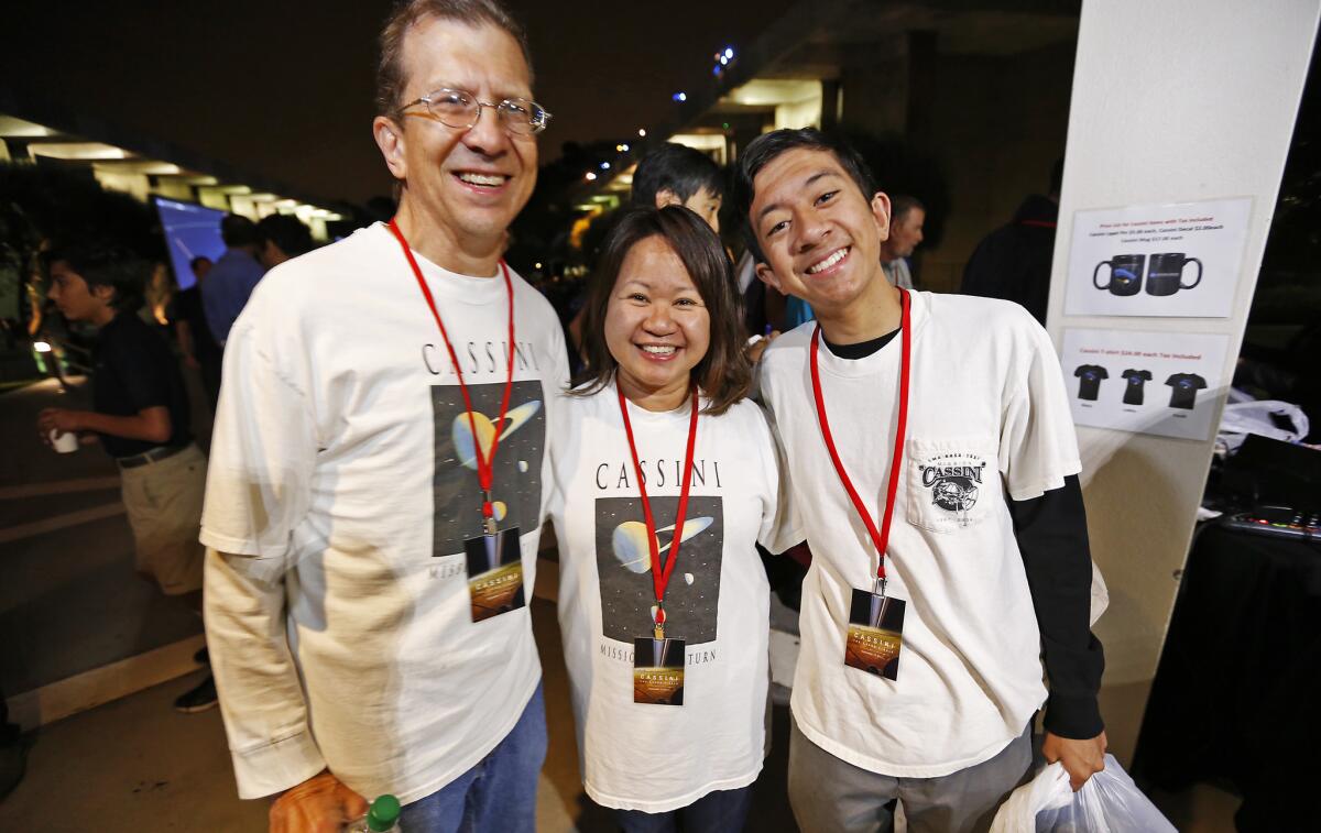 Freia Weisner, center, who works on NASA's Deep Space Network at JPL, wears the original shirt from the 1997 launch. So do husband Mark and son Erik. (Al Seib / Los Angeles Times)