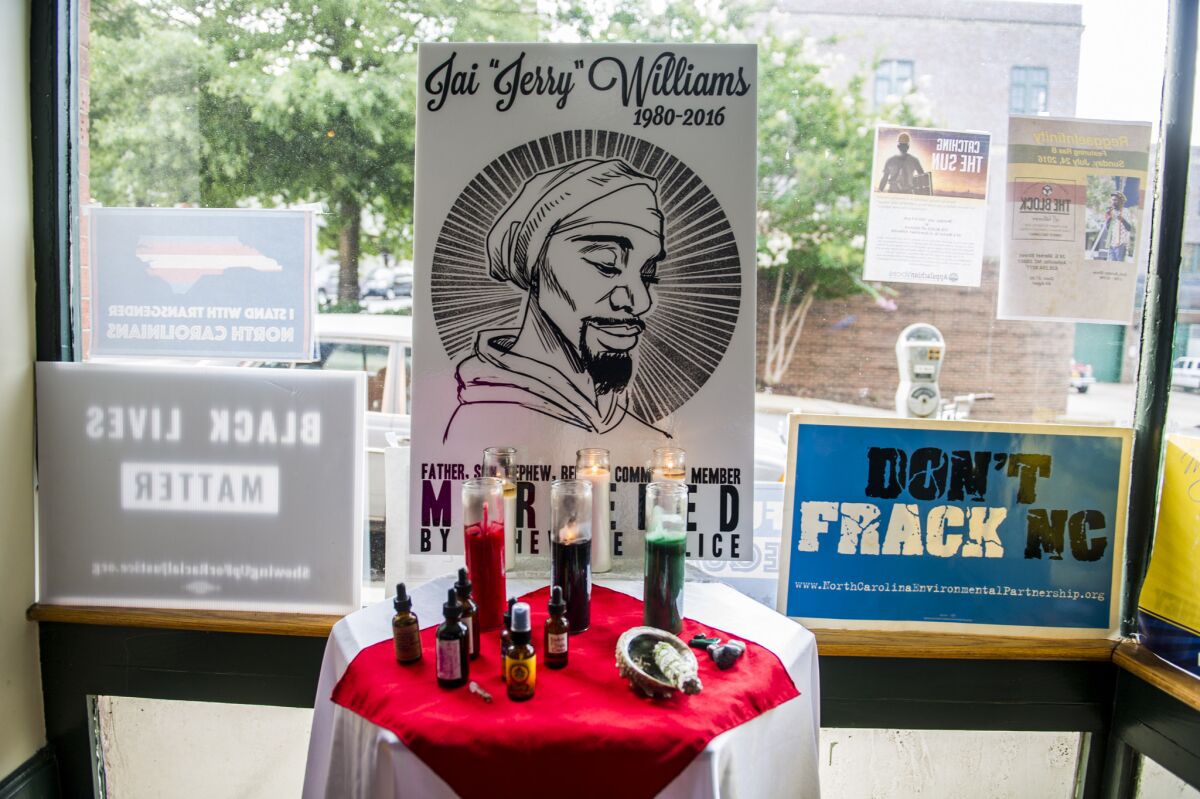 A shrine in memory of Jai "Jerry" Williams is displayed at the Block off Biltmore in Asheville, N.C., on July 12.