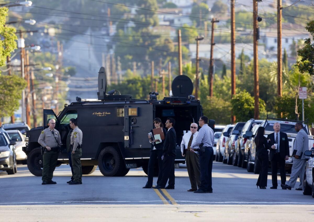 Los Angeles County sheriff's investigators at the scene of a deputy-involved shooting in East Los Angeles.