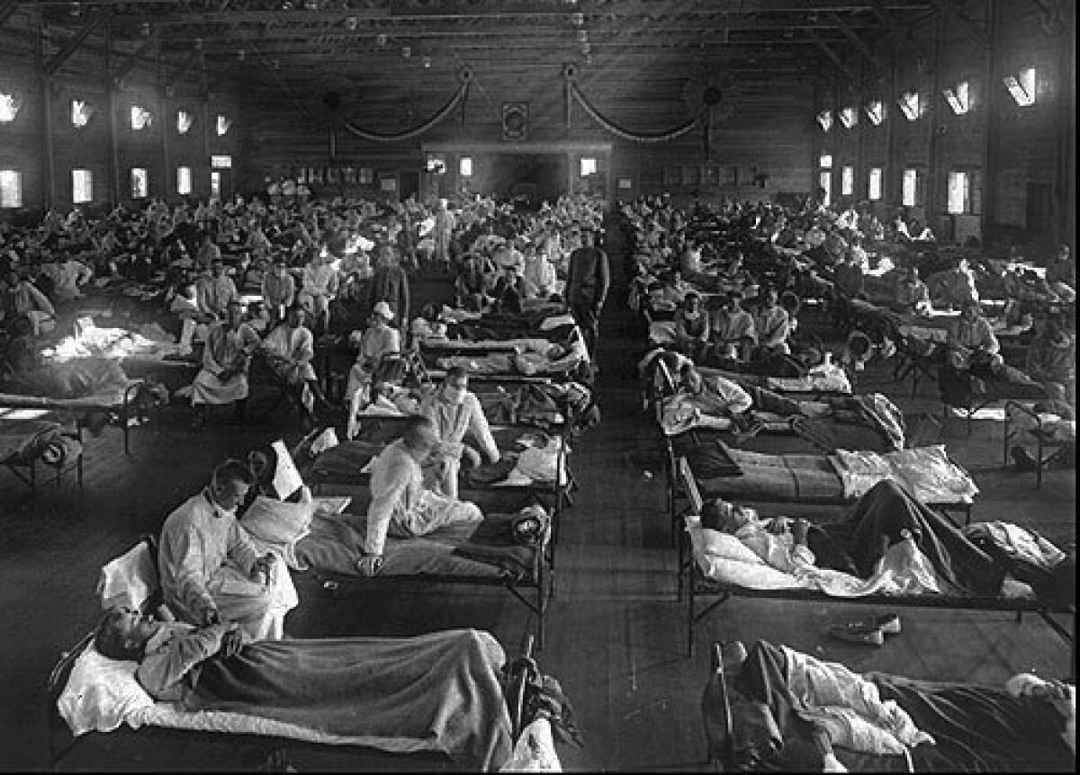 Patients crowd an emergency hospital near Ft. Riley, Kan., in 1918.