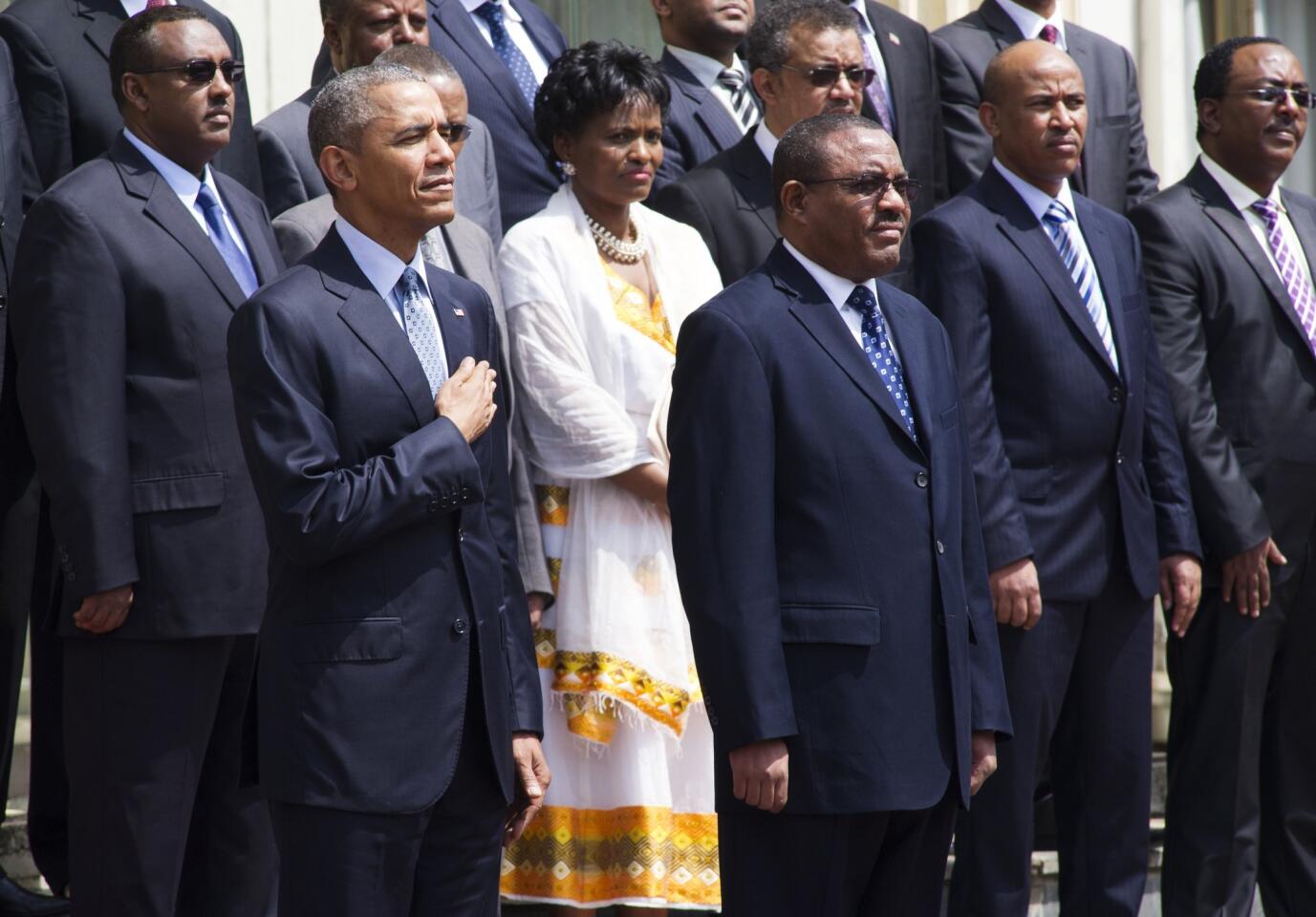 Ethiopian Prime Minister Hailemariam Desalegn (R) stands alongside President Barack Obama during the playing of the American National Anthem during a welcoming ceremony at the National Palace in Addis Ababa on July 27.
