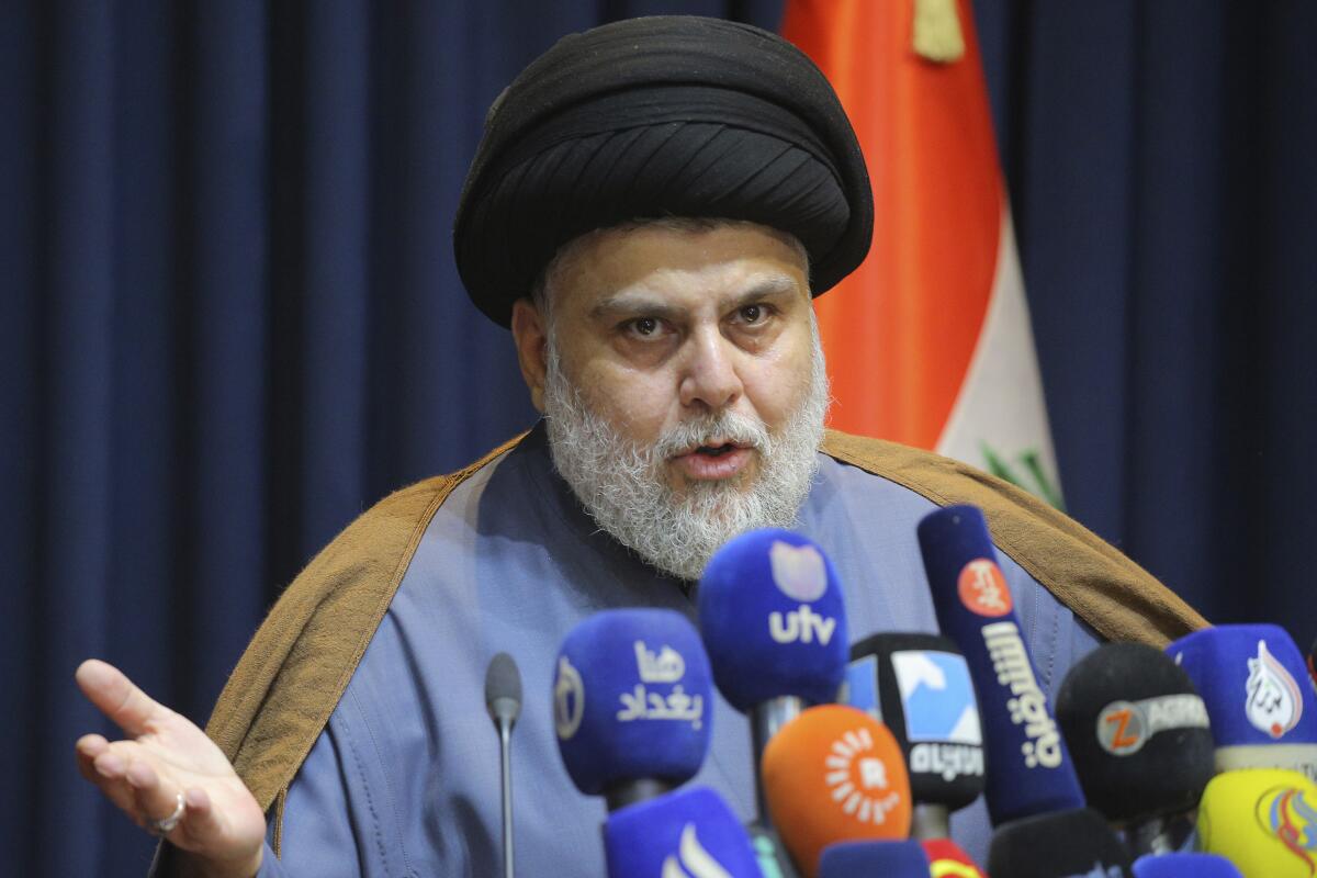 Populist Shiite cleric Muqtada Sadr speaks during a news conference.