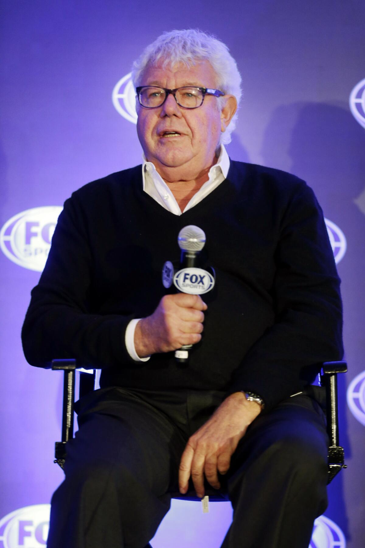 Former Fox executive David Hill speaks during a news conference in New York.