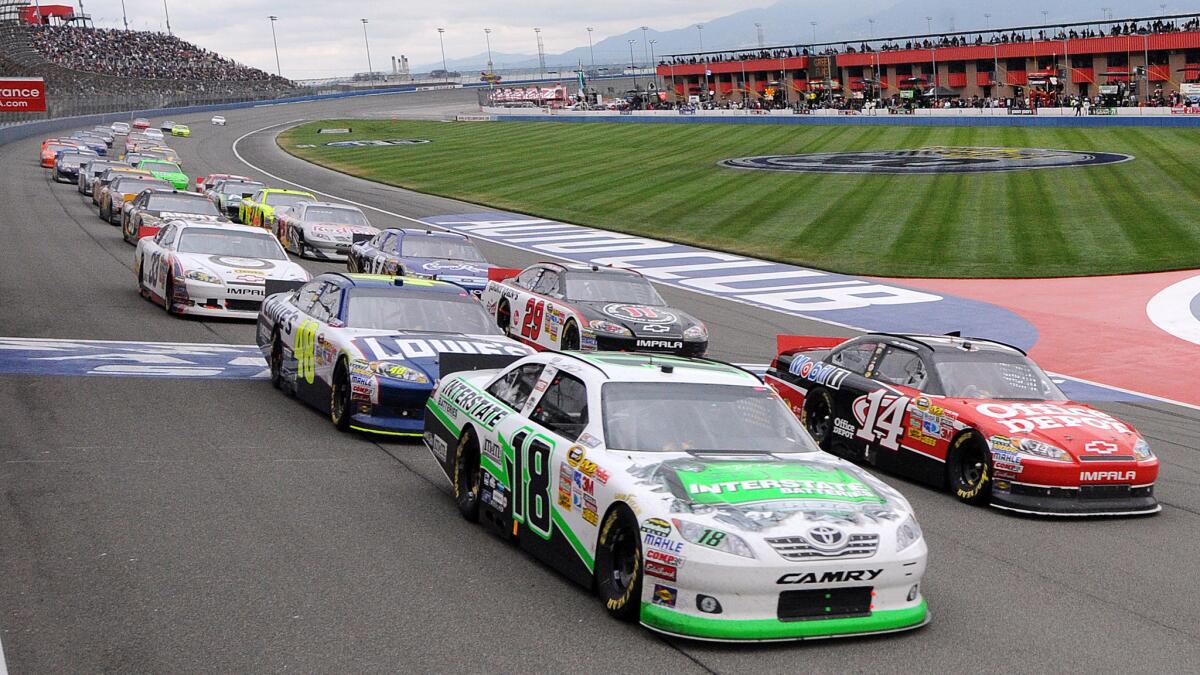 Cars circle the track before a restart of a NASCAR Sprint Cup race at Auto Club Speedway in Fontana in 2011.