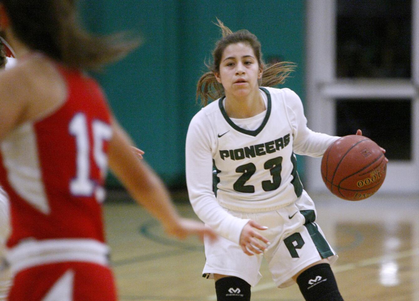 Providence High School girls basketball player #23 Ariel Gordillo yo-yos up and down while waiting for someone to open up for a pass in game vs. Bell-Jeff High School at the Providence Pioneer Showcase in Burbank on Saturday, Jan. 7, 2017.