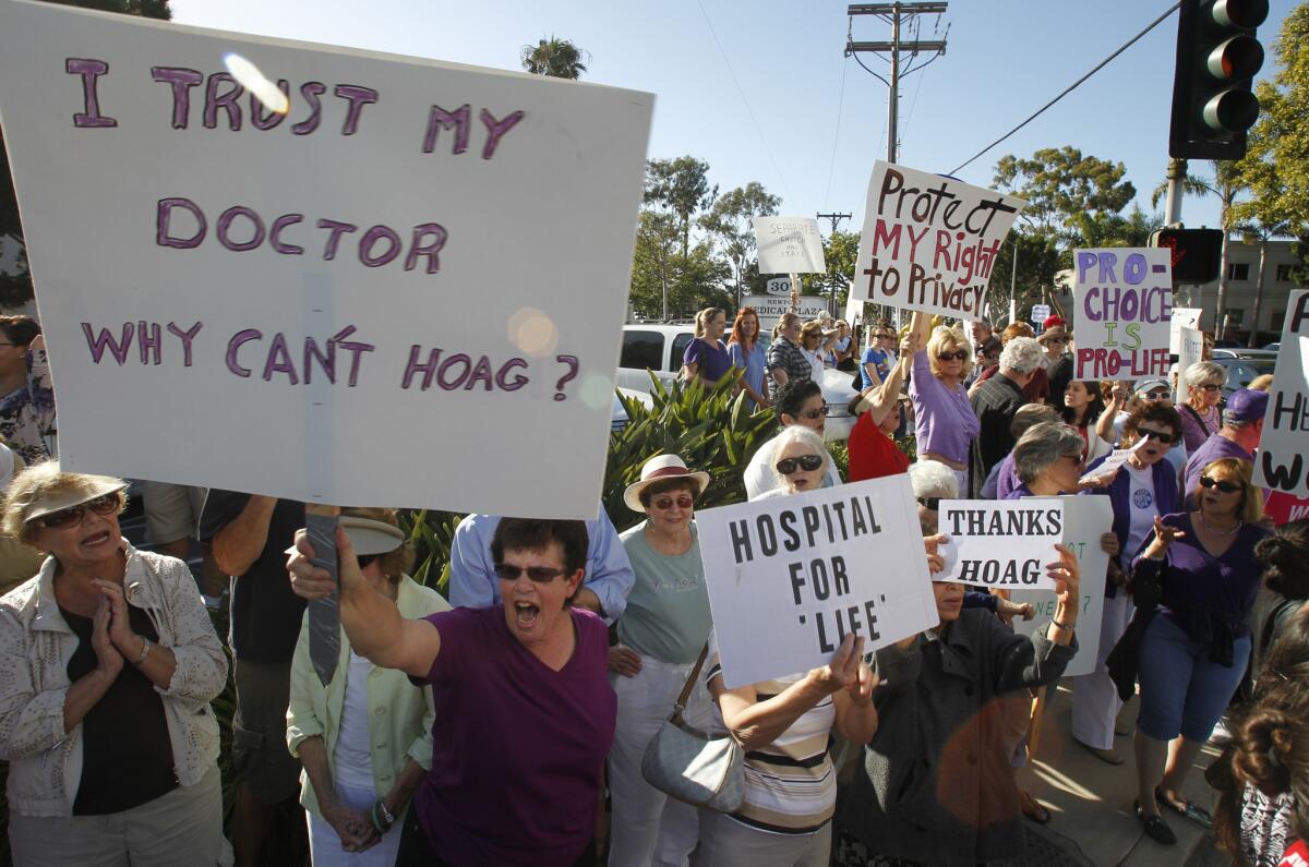 The shape of things to come? Demonstrators gather outside Hoag Hospital in Newport Beach on June 20, 2013, to protest a ban on abortions at Hoag after it partnered with a Catholic healthcare provider.