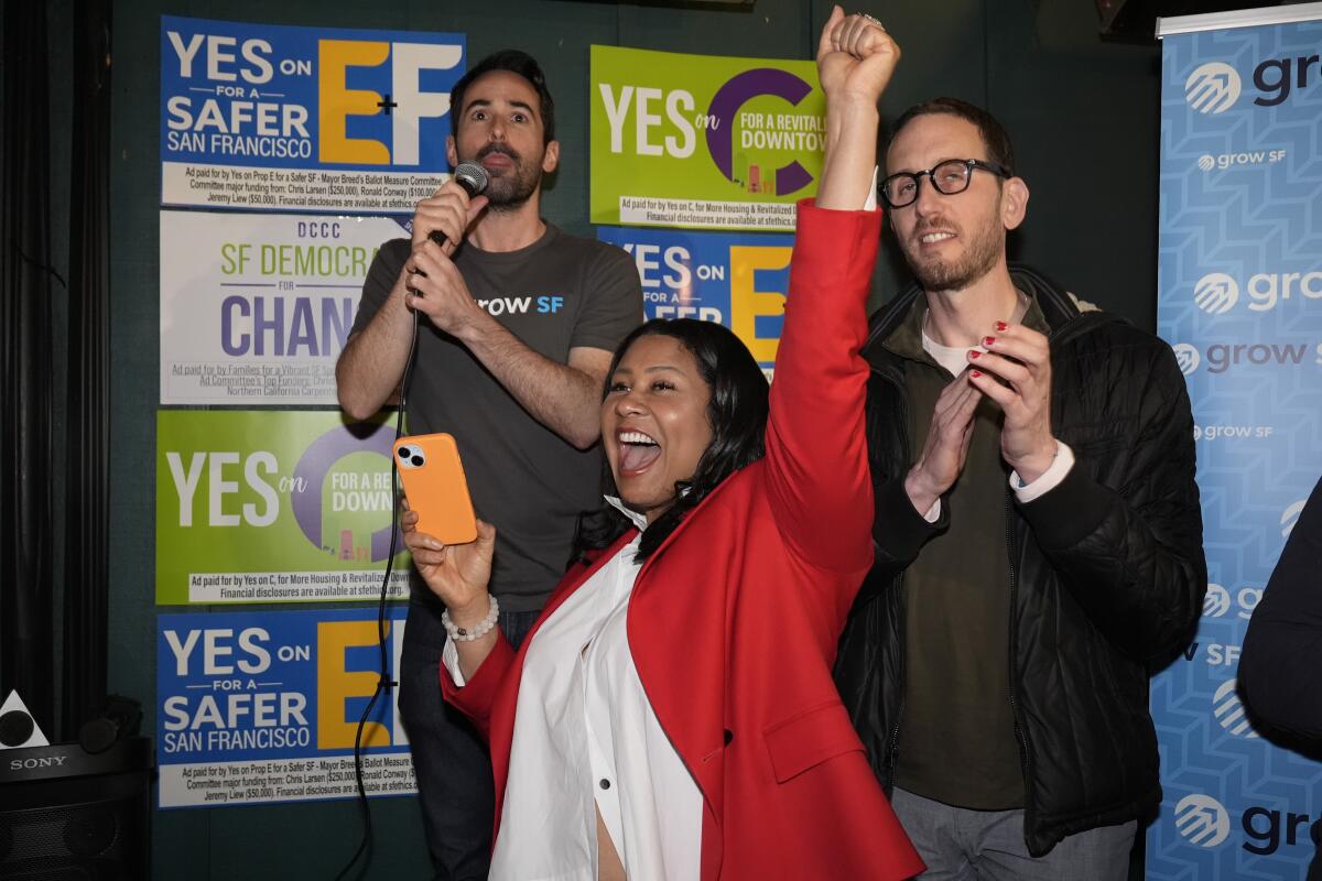 Mayor London Breed celebrates with supporters at an election night party. 