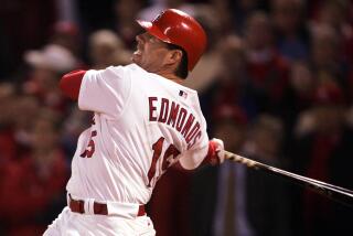 ST. LOUIS - OCTOBER 20: Jim Edmonds #15 of the St. Louis Cardinals watches his two-run walk-off home run against the Houston Astros in Game 6 of the National League Championship Series October 20, 2004 at Busch Stadium in St. Louis, Missouri. The Cardinals defeated the Astros 6-4 in the 12th inning to tie the series 3-3. (Photo By Stephen Dunn/Getty Images) *** Local Caption *** Jim Edmonds ORG XMIT: 51493215