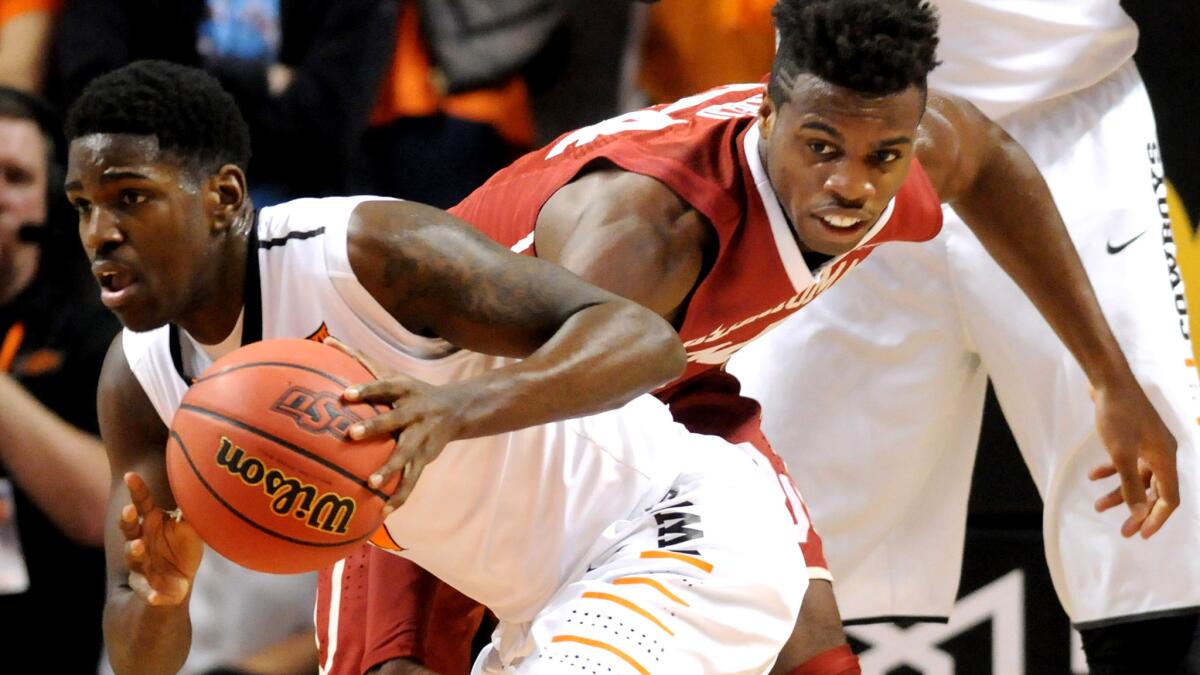 Oklahoma State Jawun Evans steals the basketball from Oklahoma guard Davon Dillard during the first half Wednesday.