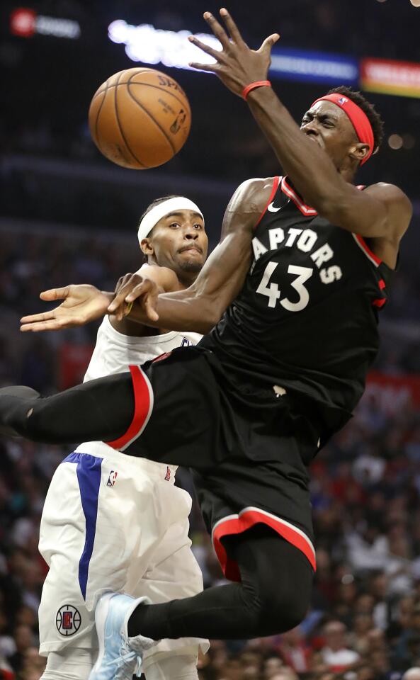 Raptors forward Pascal Siakam is fouled by Clippers forward Maurice Harkless during the fourth quarter of a game Nov. 11 at Staples Center.