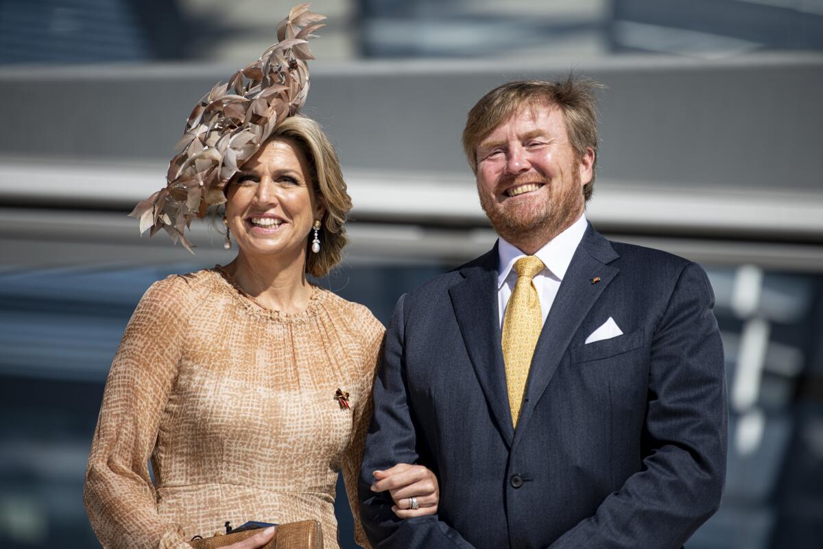 King Willem-Alexander of the Netherlands and Queen Maxima visit the roof terrace of the Reichstag building of the German Bundestag in Berlin, Germany, Tuesday, July 6, 2021. The Dutch royal couple is in Berlin for a three-day state visit. (Fabian Sommer/dpa via AP)