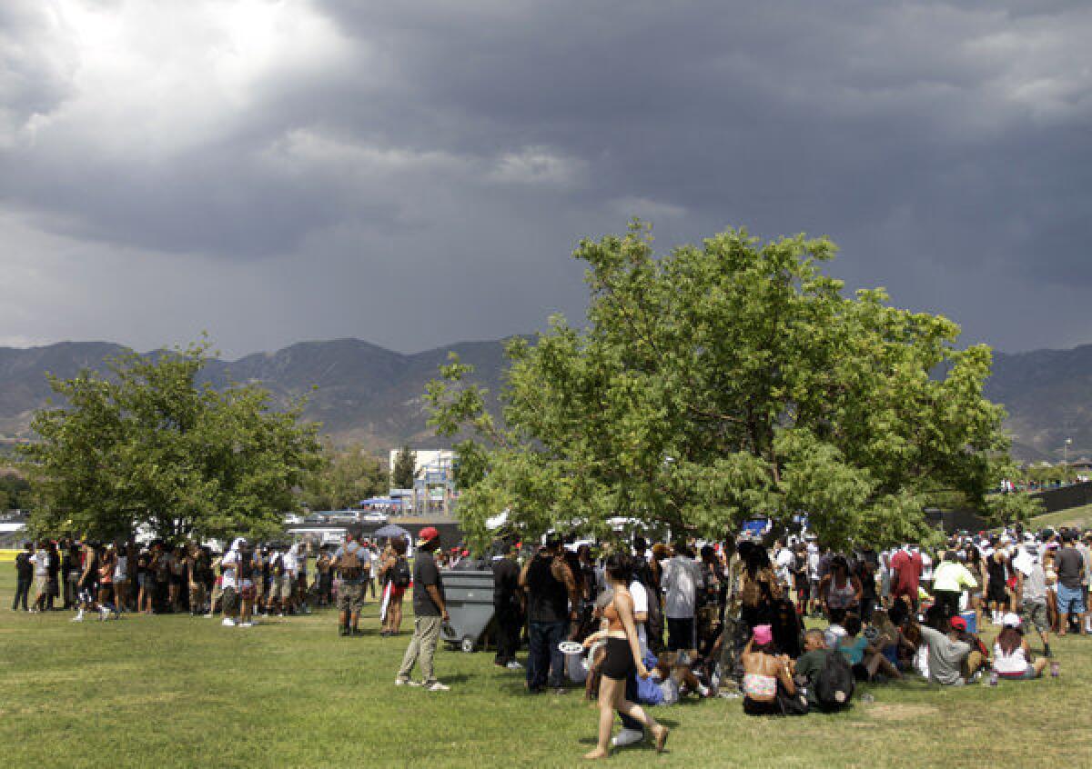 Tree shade provided a bit of heat relief for festival-goers on the first day of the Rock the Bells hip-hop show Saturday at San Manuel Amphitheatre in San Bernardino.