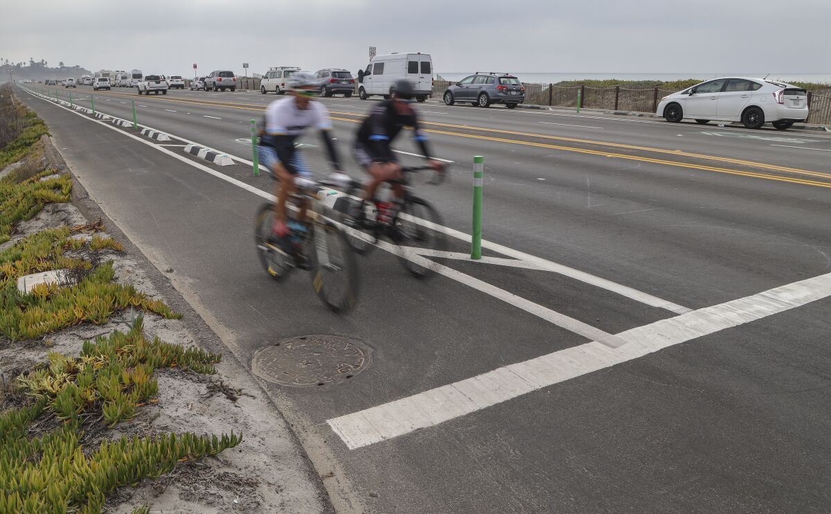 Northbound bicyclists, riding along Highway 101.