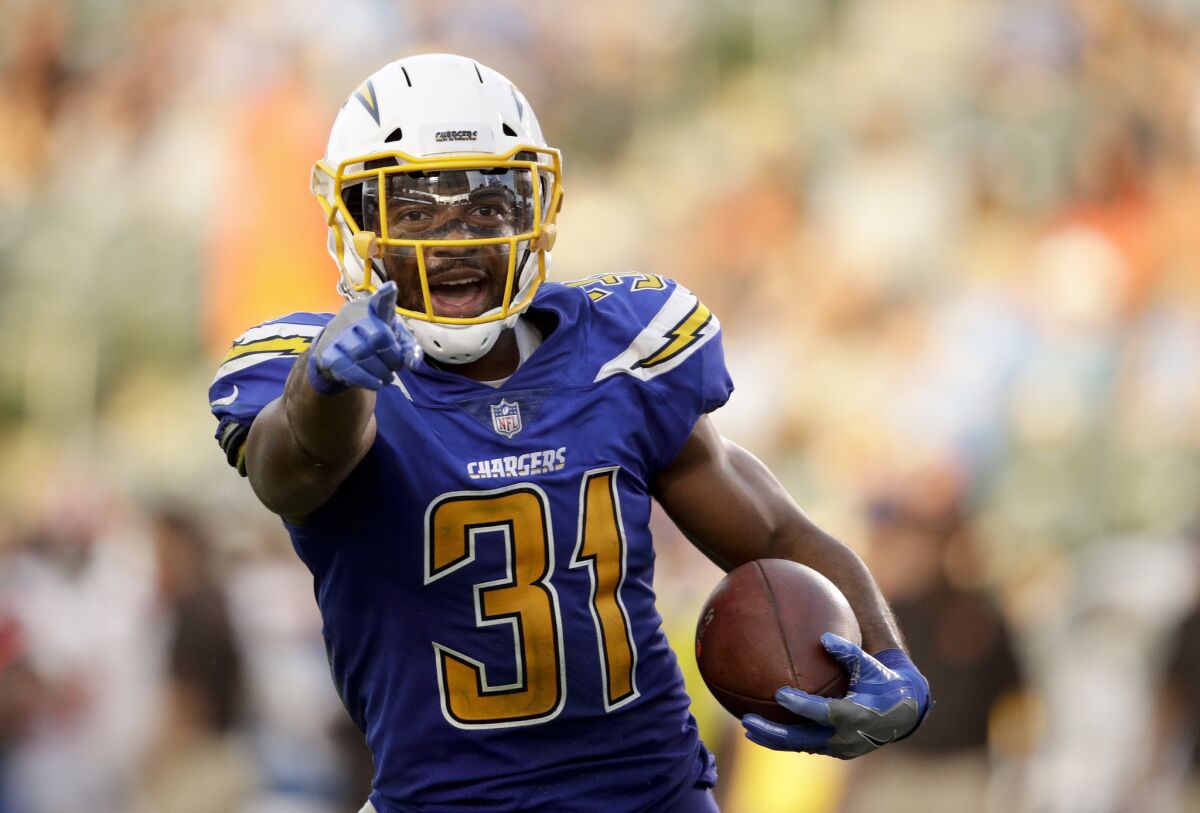 Chargers free safety Adrian Phillips celebrates an interception he made. 
