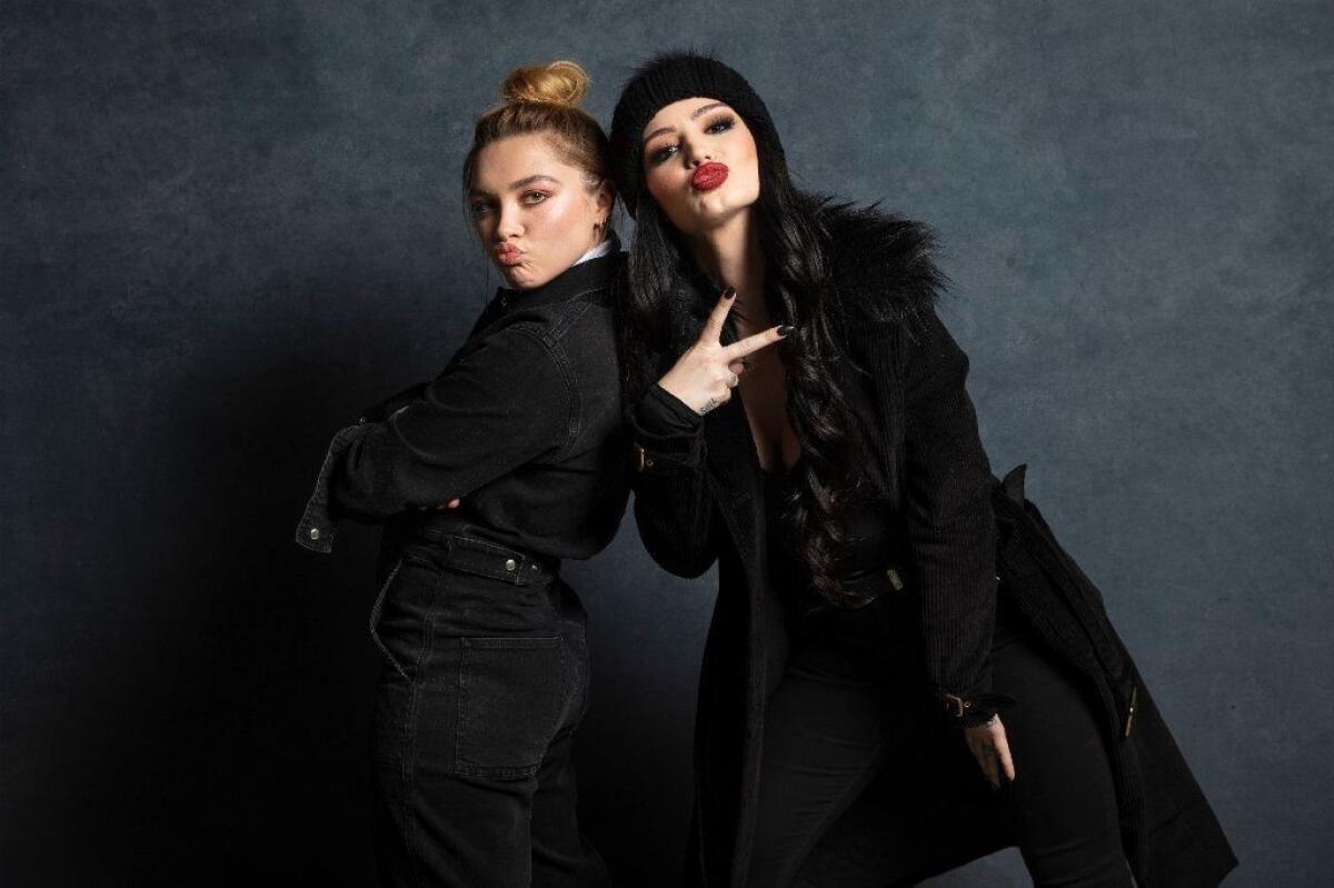 Florence Pugh, left, bonded quickly with WWE superstar Paige, whose inspirational true story she brings to life in the family comedy "Fighting With My Family."