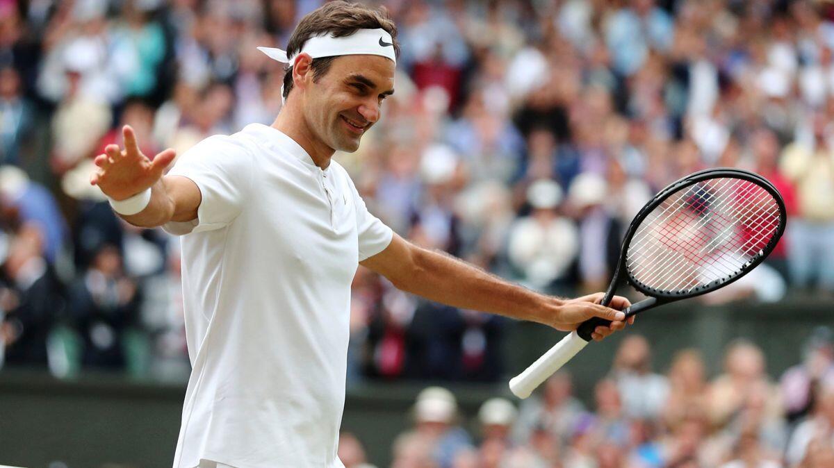 Roger Federer celebrates after beating Tomas Berdych in their men's singles semifinal match on Day 11 at Wimbledon on Friday. He will face Marin Cilic for the championship.