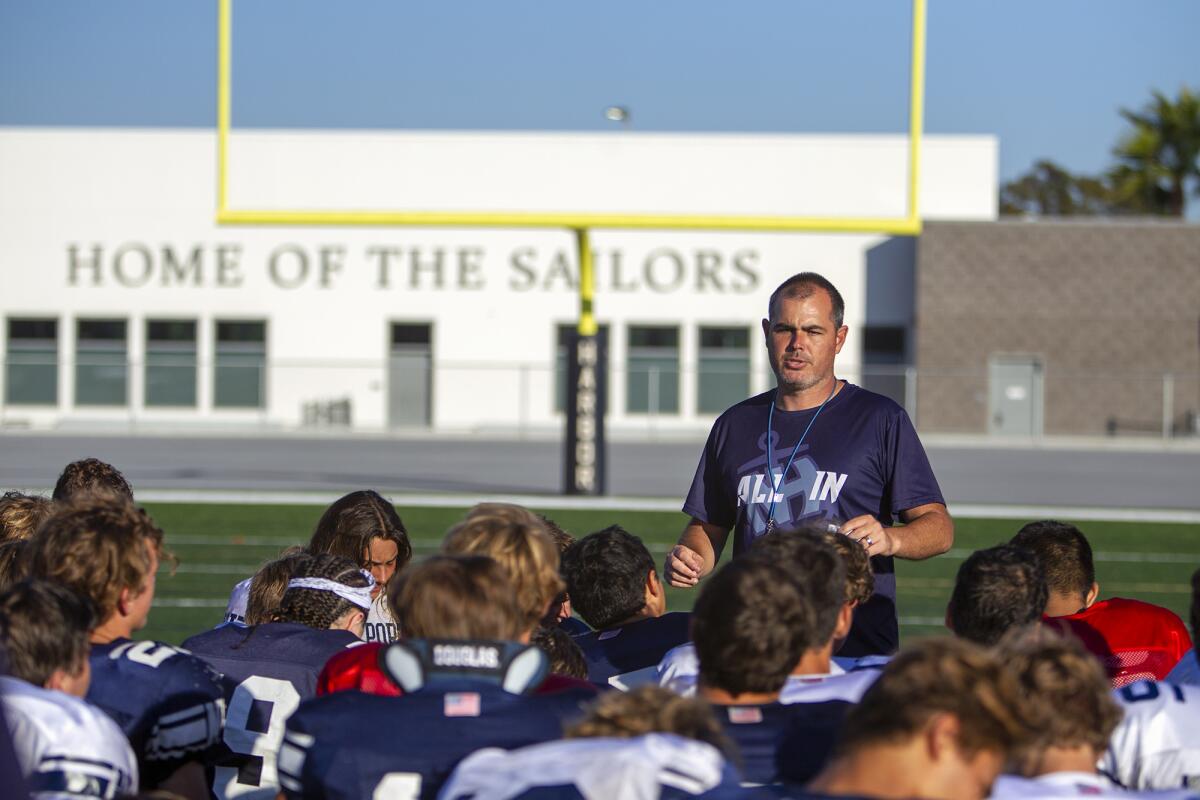 Newport Harbor coach Peter Lofthouse, talking with his team during practice on Aug. 14, has led the Sailors to their first 3-0 start since 2010.