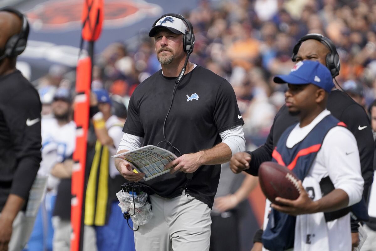 Detroit Lions head coach Dan Campbell watches his team from the sidelines during the second half of an NFL football game against the Chicago Bears Sunday, Oct. 3, 2021, in Chicago. (AP Photo/David Banks)