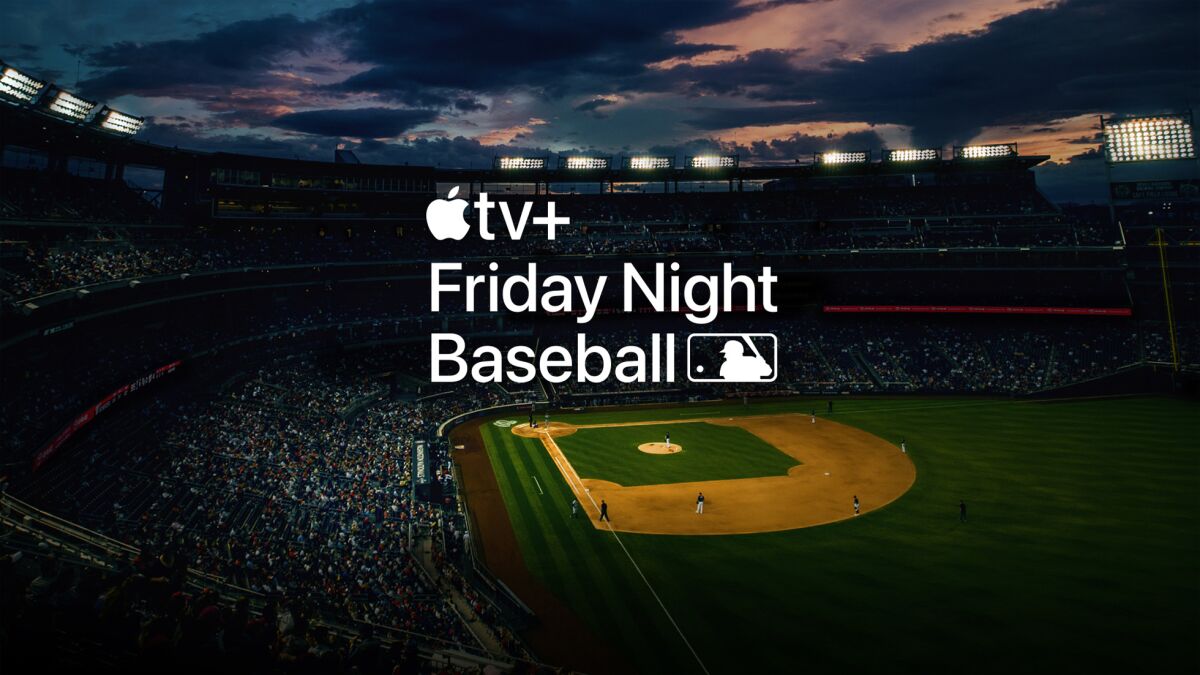 A baseball stadium at night with the Apple TV Friday Night Baseball logo