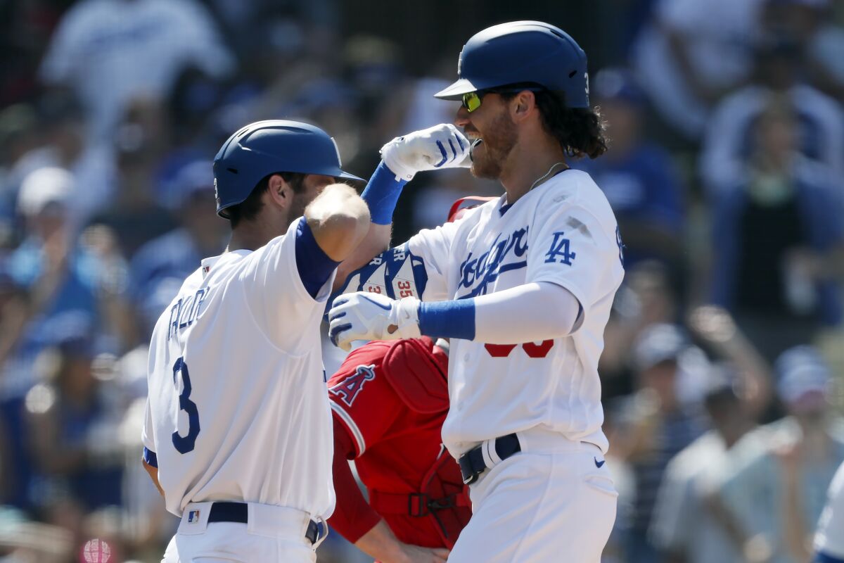 Cody Bellinger, right, celebrates with Chris Taylor after hitting a two-run home run.