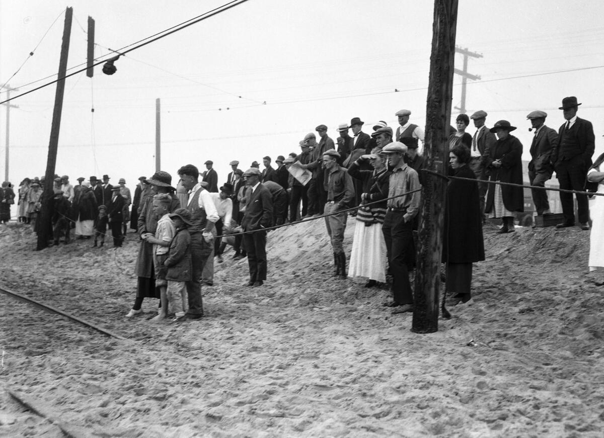 June 1, 1924: Spectators looking towards the charred remains of the Hope Development School in Playa del Rey