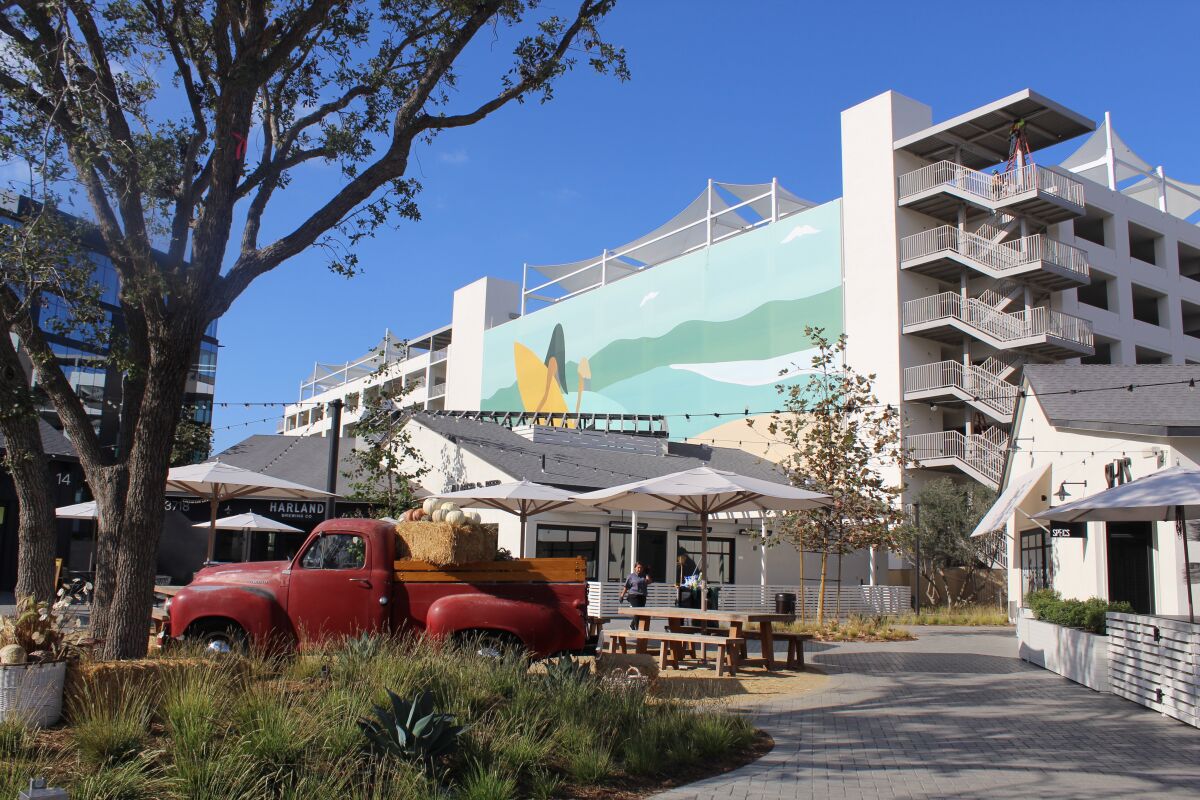 Four large-scale Andy Davis murals will be on the parking garage at One Paseo.