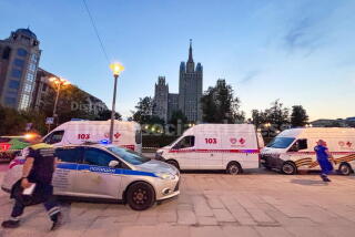 Emergency vehicles are parked in an area near a deadly explosion at a restaurant in Moscow, Saturday, Aug. 1, 2026. (Sergei Vedyashkin/Moscow News Agency via AP)