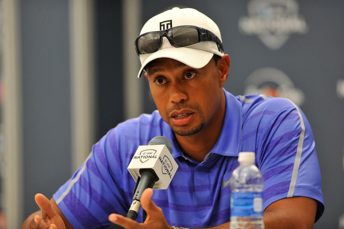 Tiger Woods, shown at a press conference last month, is favored to win the British Open.