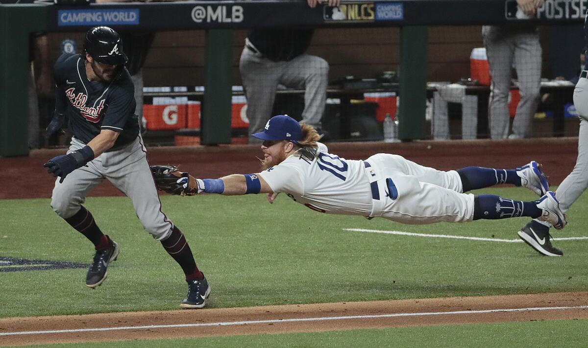 Dodgers third baseman Justin Turner tags out Atlanta Braves shortstop Dansby Swanson during Game 7 of the NLCS.