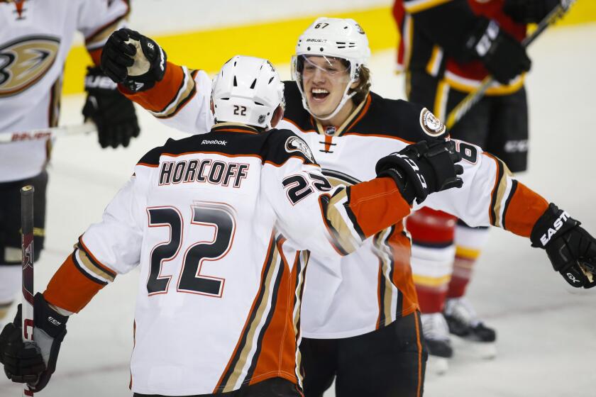 Ducks center Shawn Horcoff, left, celebrates his goal with teammate Rickard Rakell during the second period.