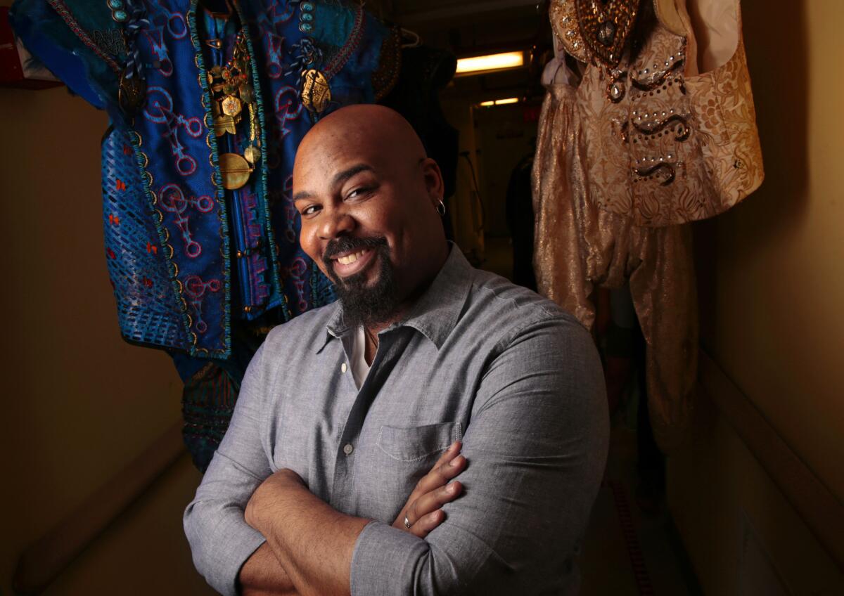 James Monroe Iglehart, photographed among some of his “Aladdin” costumes at the New Amsterdam, describes the genie as “the consummate showman.”