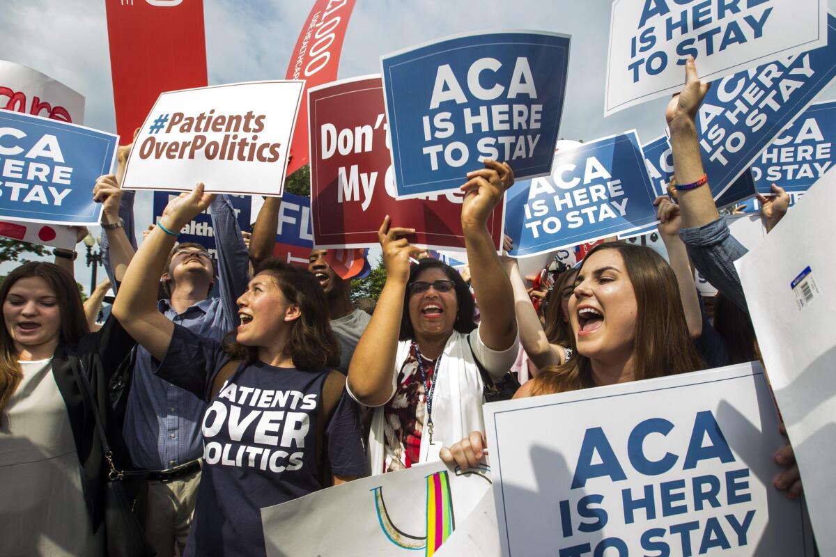 Supporters of the Affordable Care Act cheer after the Supreme Court ruled that Obamacare tax credits can go to residents of any state, in Washington, D.C. on June 25.