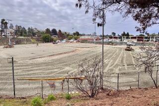 Bulldozers have cleared the Palisades High baseball field so that bungalows can be used. 