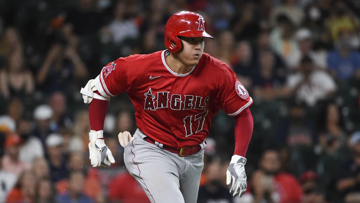 Angels designated hitter Shohei Ohtani runs to first against the Houston Astros on Saturday.