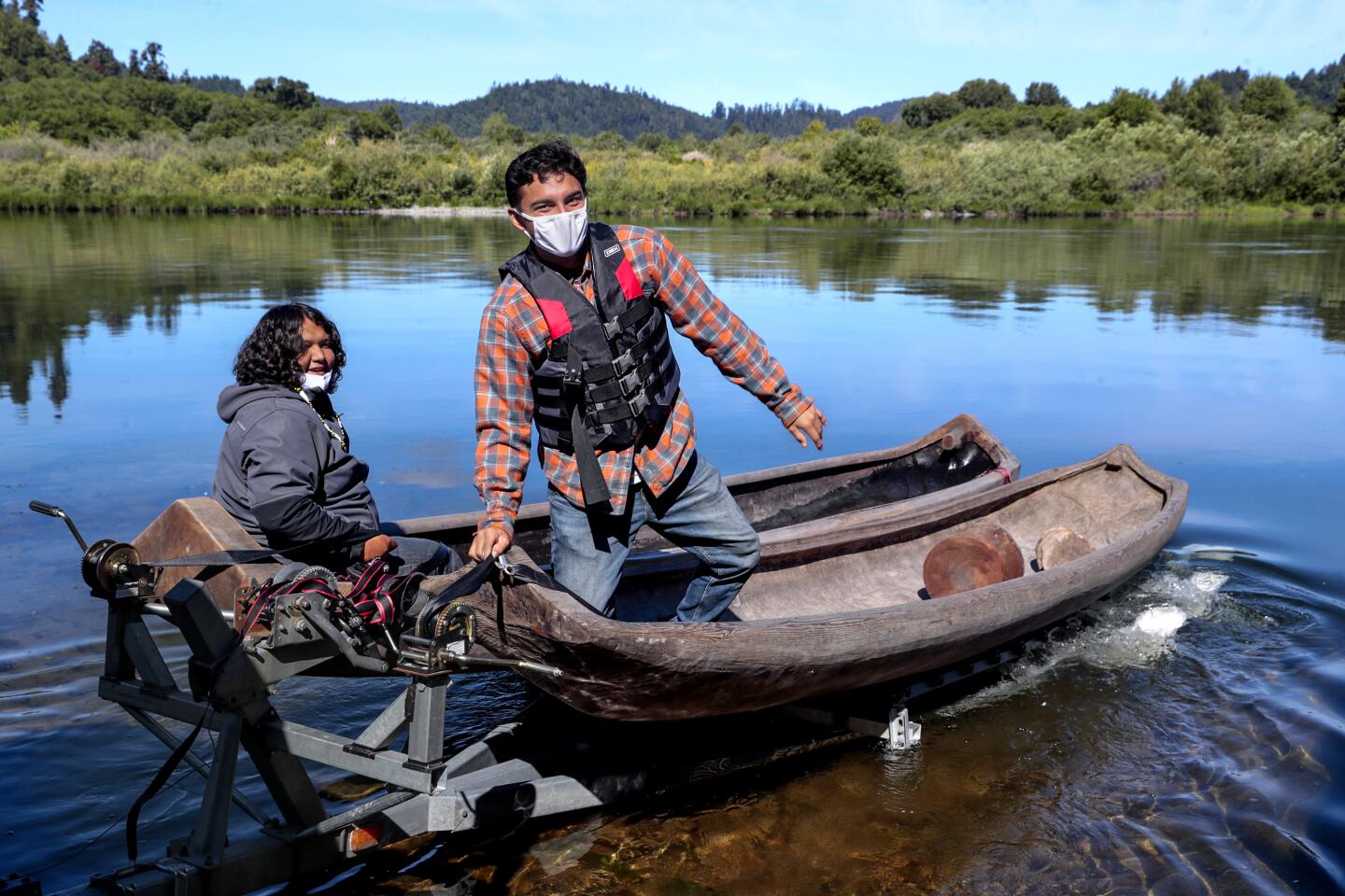Two Yurok guides in a redwood canoe.