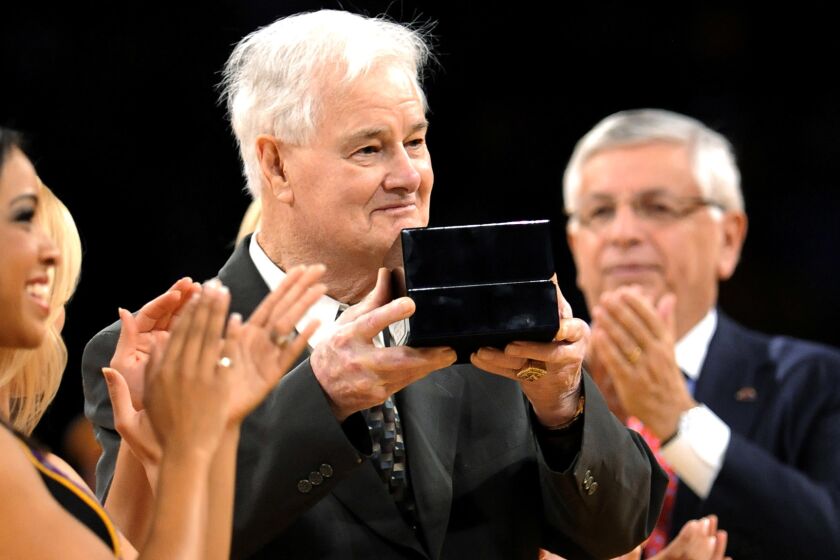 Lakers assistant coach Tex Winter receives his 2009 NBA championship ring during a ceremony at Staples Center on Oct. 27, 2009.