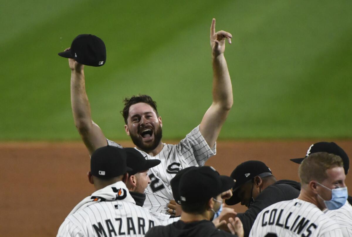 Chicago White Sox pitcher Lucas Giolito reacts with teammates after closing out a no-hitter.