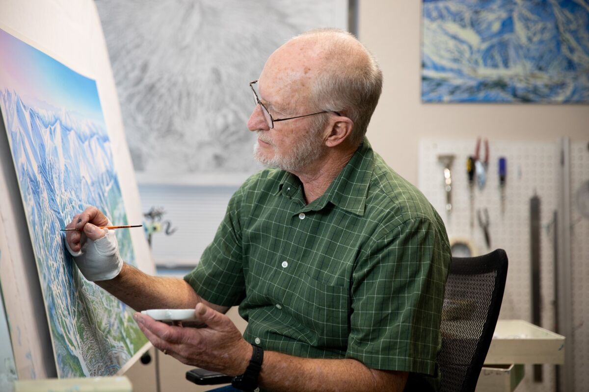 James Niehues works on a map at his home studio in Parker, Colo.