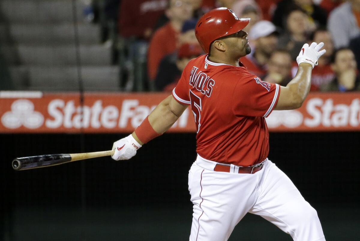 Angels first baseman Albert Pujols watches one of his two home runs against the Kansas City Royals.